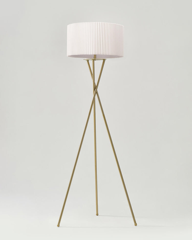 Crossed-Base Tripod Floor Lamp — Crossed brass-finish tripod base with pleated drum shade and LED source