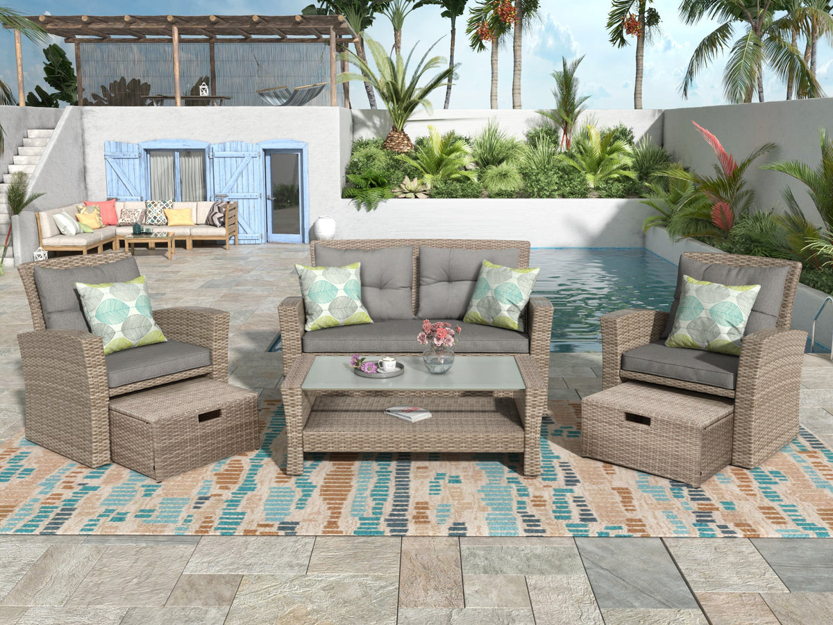 Woven Rattan Outdoor Seating Set — Four-piece woven rattan set with storage ottomans and glass coffee table