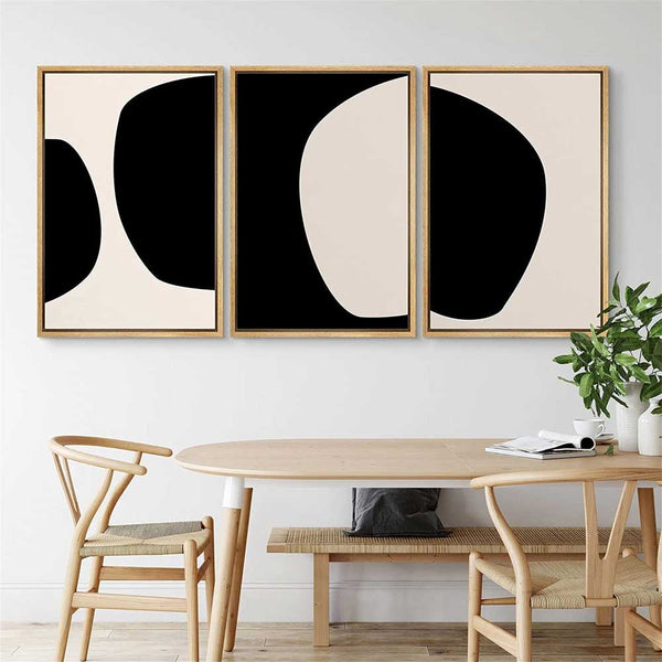 Abstract Geometric Canvas Triptych — Three-panel abstract canvas set in black and warm off-white, frame finish options