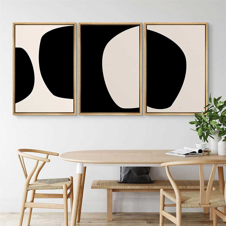 Abstract Geometric Canvas Triptych — Three-panel abstract canvas set in black and warm off-white, frame finish options