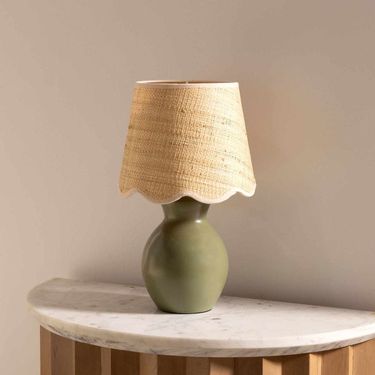 Matte Ceramic Scallop-Shade Table Lamp — Sage ceramic base and scallop-edged rattan shade for gentle, grounded light