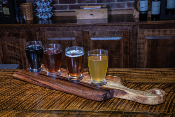 Live Edge Walnut Handled Bread Board — Hand-shaped walnut board with live edge and beeswax finish for daily use