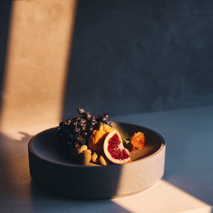 Micro Terrazzo Concrete Round Platter — Thick-walled concrete platter in five micro terrazzo finishes, for table or counter
