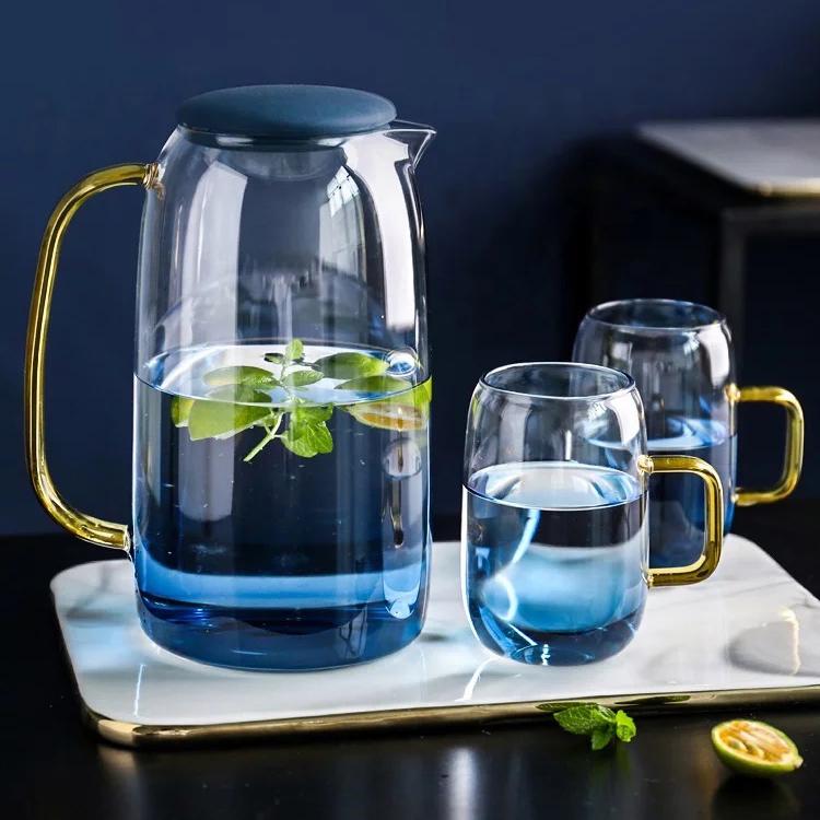 Ombre Glass Pitcher and Cup Set — Gradient tinted glass pitcher and two handled cups with gold-tone accents