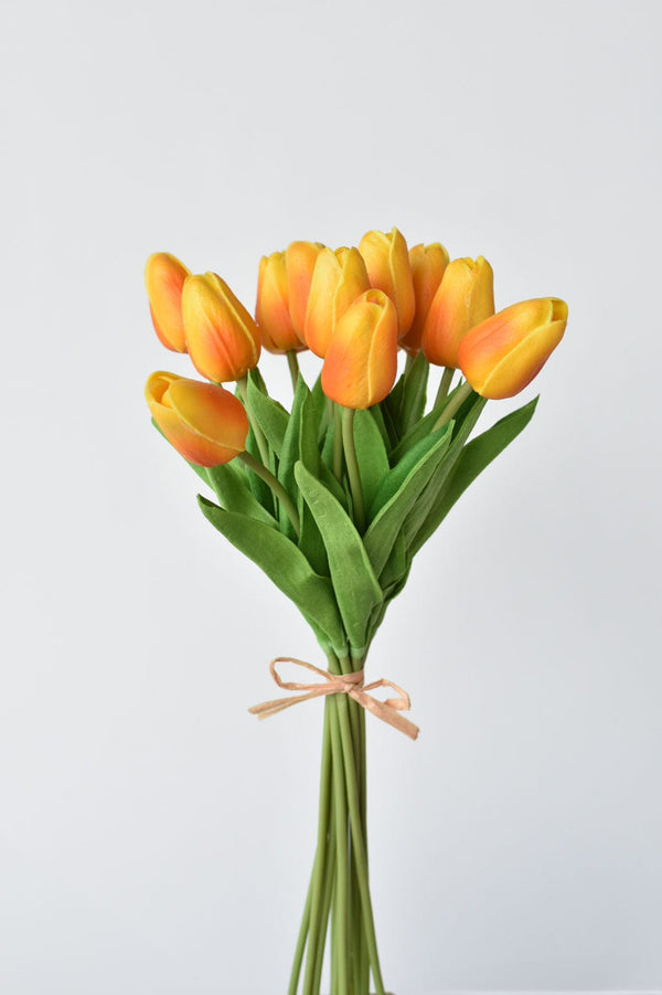 Real-Touch Tulip Bundle Stems — Twelve real-touch tulip stems in warm amber and yellow, raffia-tied