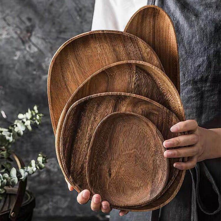 Oval Wood Serving Board Set — Five graduated oval boards in a warm, hand-finished dark wood-grain
