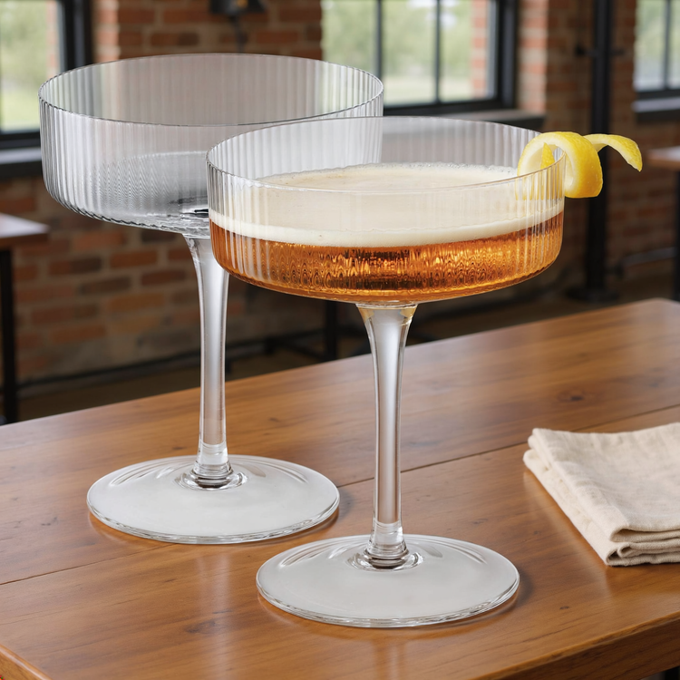 Ribbed Clear Glass Coupe Set styled in a warm editorial loft