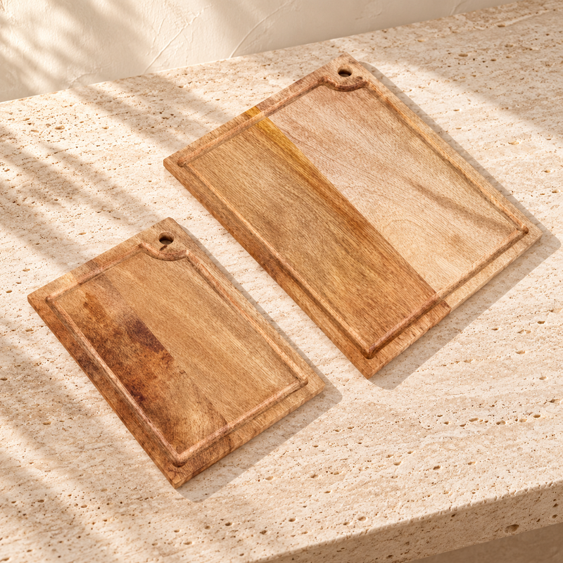 Mango Wood Cutting Board Set on a sunlit pale travertine counter