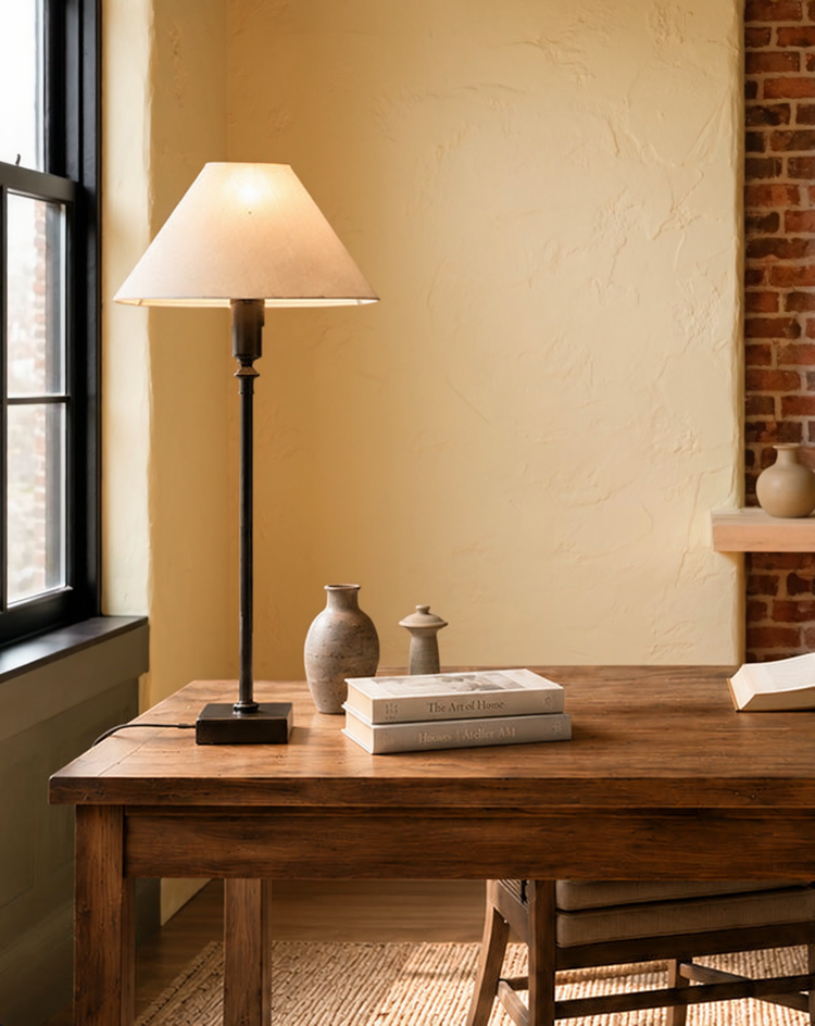 Ivory Adjustable Bronze Table Lamp in a warm editorial loft with natural window light