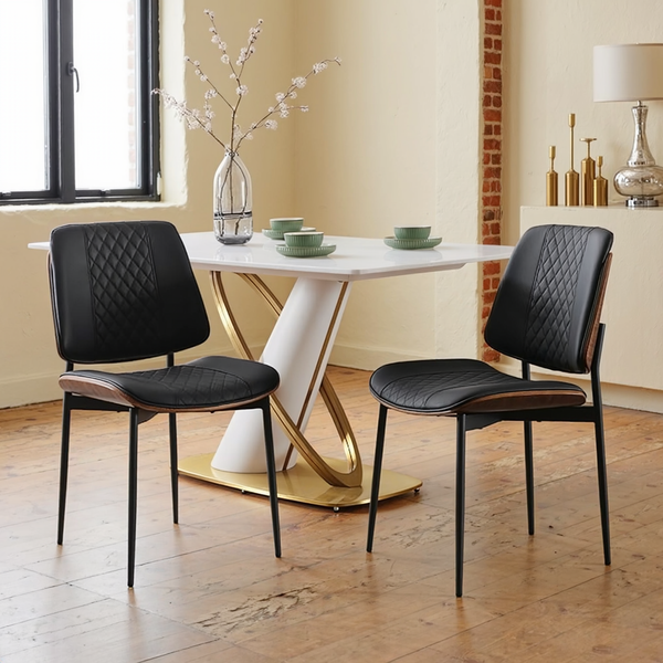 Black Faux Leather Bentwood Dining Chairs, Set of 2 in a warm editorial loft with natural window light.