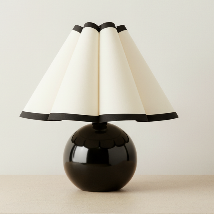 Pleated Shade Globe Base Table Lamp on a neutral concrete tabletop