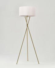 Crossed-Base Tripod Floor Lamp — Crossed brass-finish tripod base with pleated drum shade and LED source