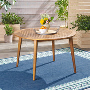 Acacia and Wicker Outdoor Dining Set — detail of finish and surface variation