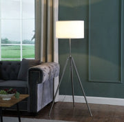 Adjustable Tripod Chrome Floor Lamp styled in a warm reading corner