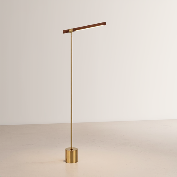 Tall brass floor lamp with a walnut wood LED bar and compact cylindrical brass base