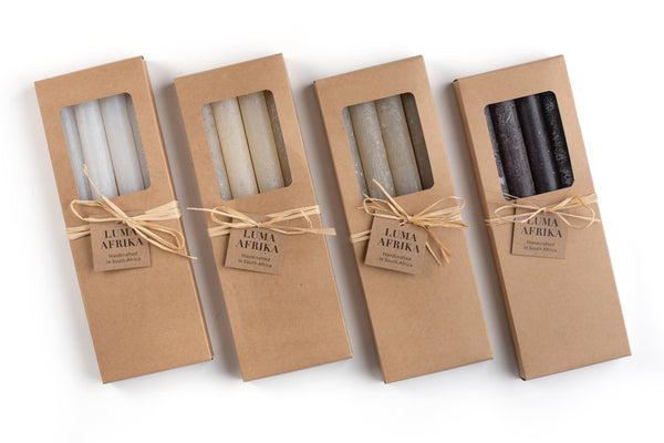 Four white candles with frosted, taper