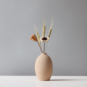 Matte Ceramic Sculptural Vase styled with dried botanicals on a shelf