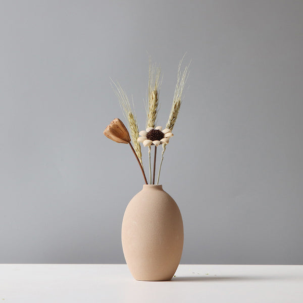 Matte Ceramic Sculptural Vase styled with dried botanicals on a shelf