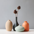 Matte Ceramic Sculptural Vase — Sand-textured matte ceramic vases in four forms and four earthy colorways