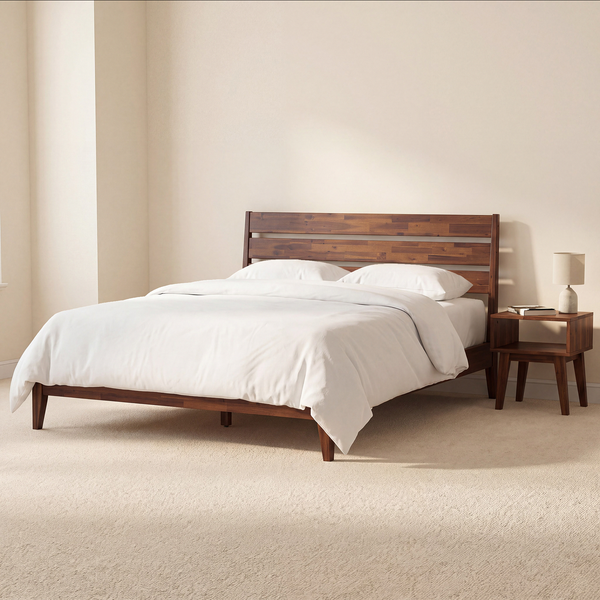 Brown wood platform bed with ivory bedding and a matching nightstand against a beige bedroom wall.