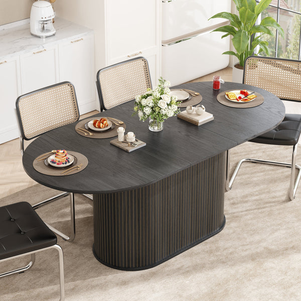 Fluted Oval Extendable Dining Table — Oval extendable dining table with fluted pedestal base, seats four to six