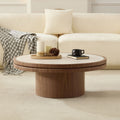 Sintered Stone Round Pedestal Coffee Table — Round stone-top coffee table with warm wood-grain pedestal base