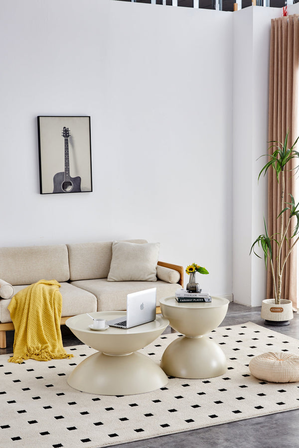 Hourglass Metal Round Table Set styled with ceramics and a linen runner