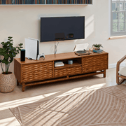 Relief-Carved Wood TV Stand — styled in a complete room vignette