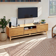 Relief-Carved Wood TV Stand in a styled home setting