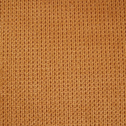 Channel-Tufted Ochre Upholstered Dining Chairs — close-up of label and production detail