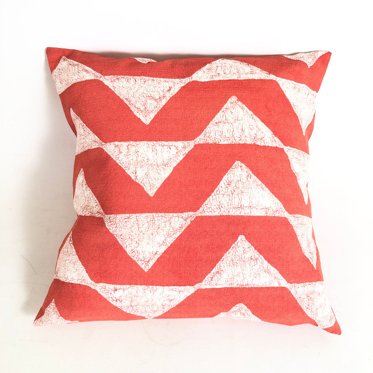 A hand-painted pattern that earns its place on the sofa