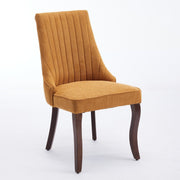 Channel-Tufted Ochre Upholstered Dining Chairs — detail of finish and surface variation