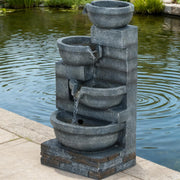 Four-Tier Cascading Resin Garden Fountain — Four-tier resin fountain with LED lighting for patios and garden beds
