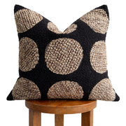 Woven Dot Textured Pillow Cover layered on a neutral sofa with throw blanket