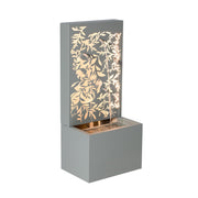 Leaf Cutout Metal Outdoor Water Fountain styled in an outdoor living space