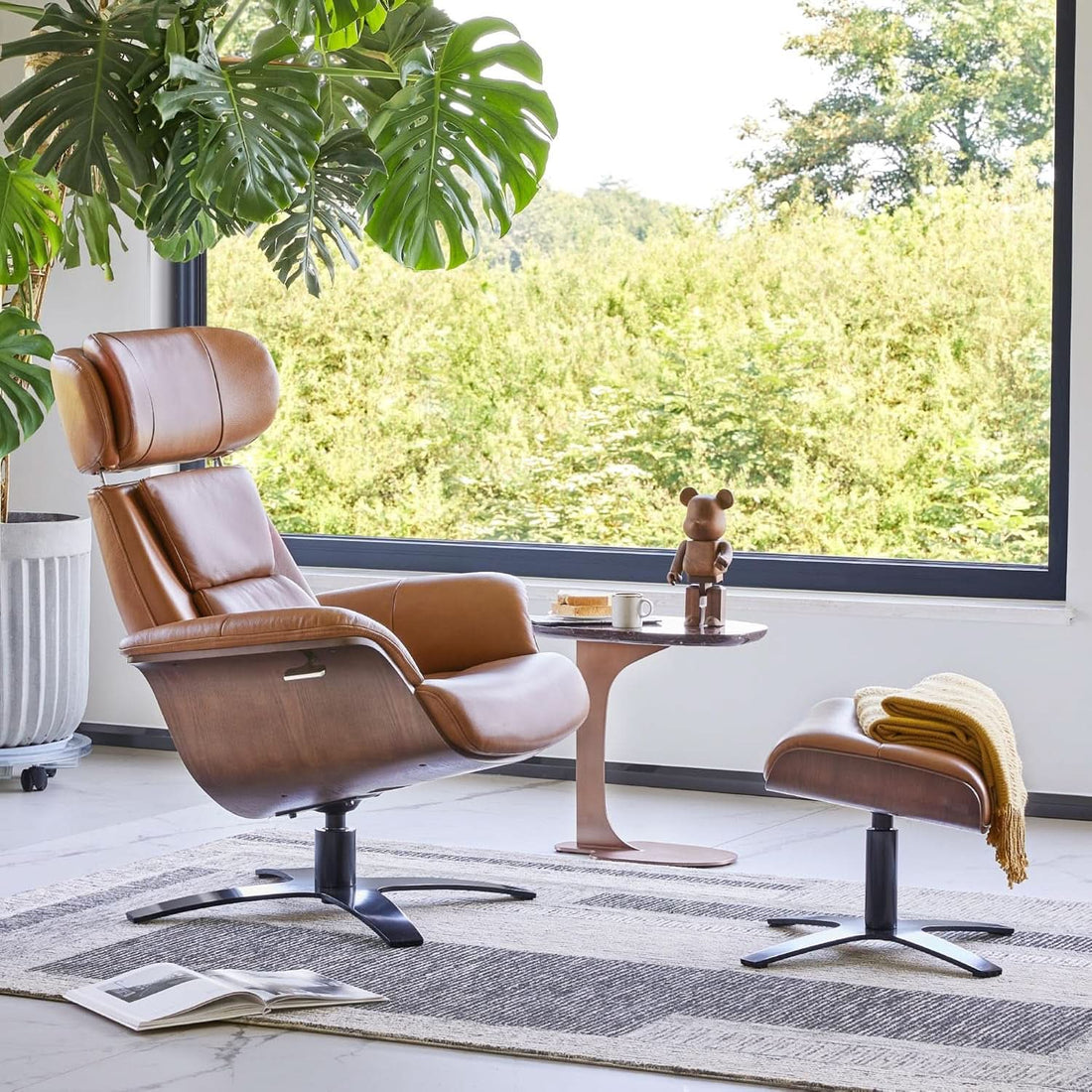 Tan brown armchair, rounded cushioned back and seat, curved armrests