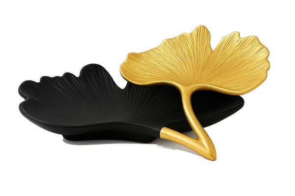 Black and Gold Ginkgo Leaf Tray styled on a console with ceramics and books