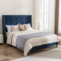 Tufted Velvet Wingback Queen Bed — Navy velvet queen bed with tufted wingback headboard and nailhead trim