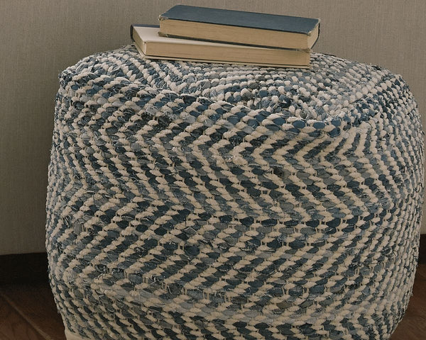 White pouf with chevron diagonal stripes in charcoal gray, cylindrical