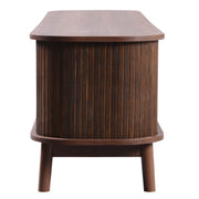 Rattan-Front Fluted Wood TV Stand — styled in a complete room vignette