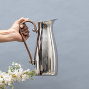 Polished Steel Leather-Handle Pitcher — detail of finish and surface variation