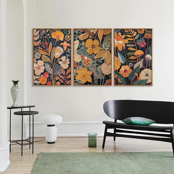 Three burnt orange Burnt Orange Botanical Canvas Wall Art prints with botanical flowers and leaves, framed rectangular