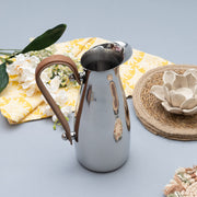 Polished Steel Leather-Handle Pitcher — styled in a complete room vignette