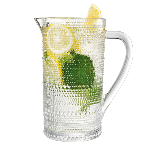 Hobnail Clear Glass Pitcher styled on a marble bar cart with glassware