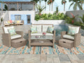 All-Weather Woven Rattan Seating Set — Six-piece woven rattan set with cushions, armchairs, ottomans, and glass-top table