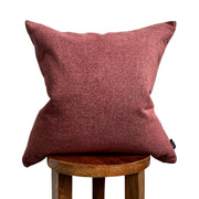 Rust Bouclé-Texture Pillow Cover layered on a neutral sofa with throw blanket