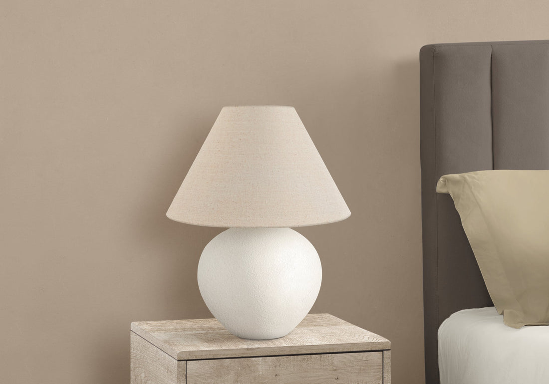 Textured Ceramic Globe Table Lamp — Rounded ceramic base and woven shade for quiet, ambient evening light
