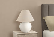 Textured Ceramic Globe Table Lamp — Rounded ceramic base and woven shade for quiet, ambient evening light