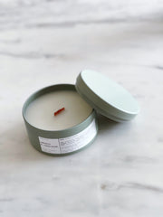 Coconut Crème Wooden Wick Travel Candle styled on a table with linen and ceramics