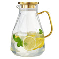 Faceted Glass Pitcher Gold Lid styled on a marble bar cart with glassware